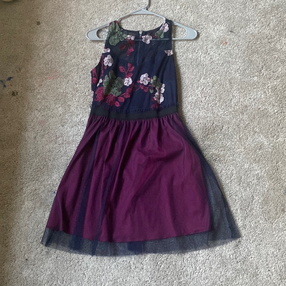 A flower dress, most colors are purple, blue and pink.